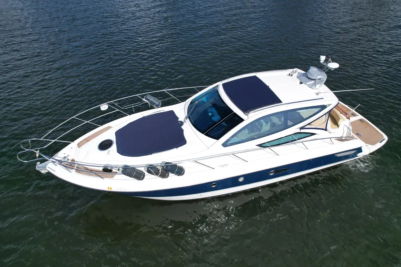 Slide: The Image of 2009 Cranchi Mediterranee 43 yacht cruising on open water, showcasing sleek design and luxury features. - 27