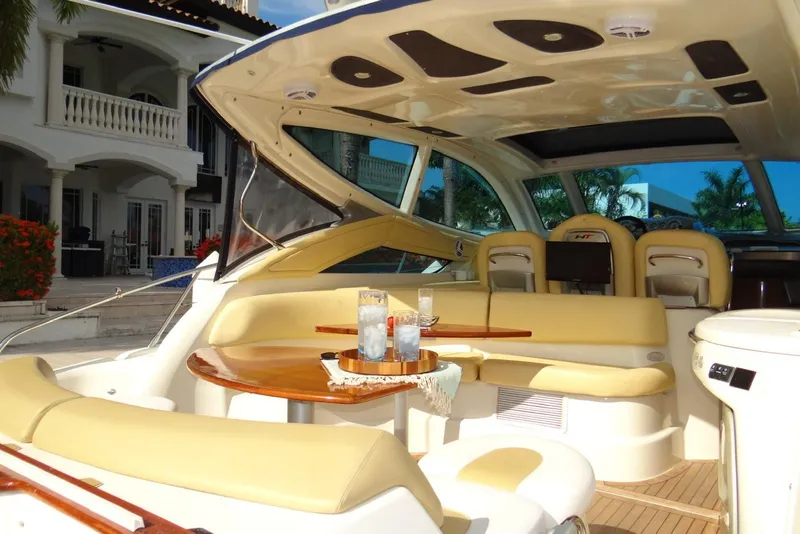 Slide: The Image of Luxurious 2009 Cranchi Mediterranee 43 yacht interior with elegant seating and table setup. - 8
