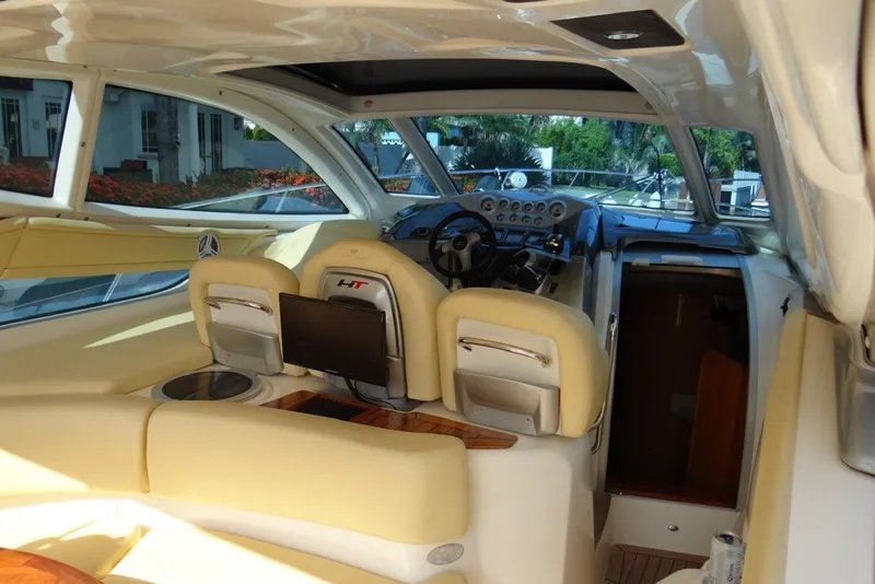 Slide: The Image of Interior of 2009 Cranchi Mediterranee 43 yacht, featuring luxurious seating and modern dashboard. - 11