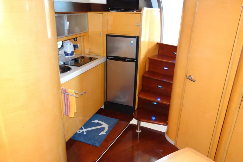 Slide: The Image of Interior of 2009 Cranchi Mediterranee 43 yacht with kitchenette and wooden stairs. - 14