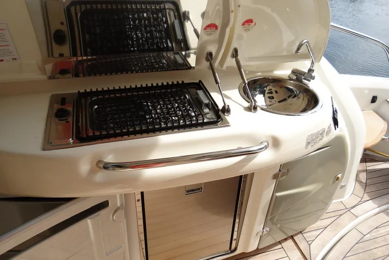 Slide: The Image of Outdoor kitchen on 2009 Cranchi Mediterranee 43 yacht with grill and sink. - 10