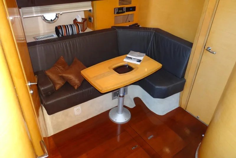 Slide: The Image of Interior of 2009 Cranchi Mediterranee 43 yacht with cozy seating and wooden table. - 12