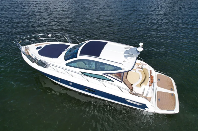 Slide: The Image of 2009 Cranchi Mediterranee 43 yacht on open water, showcasing sleek design and luxury features. - 2