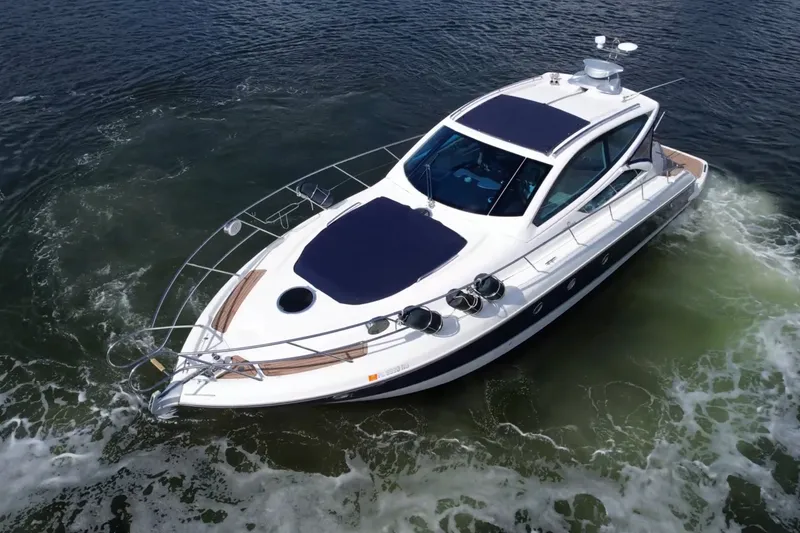 Slide: The Image of 2009 Cranchi Mediterranee 43 yacht cruising on open water. - 30
