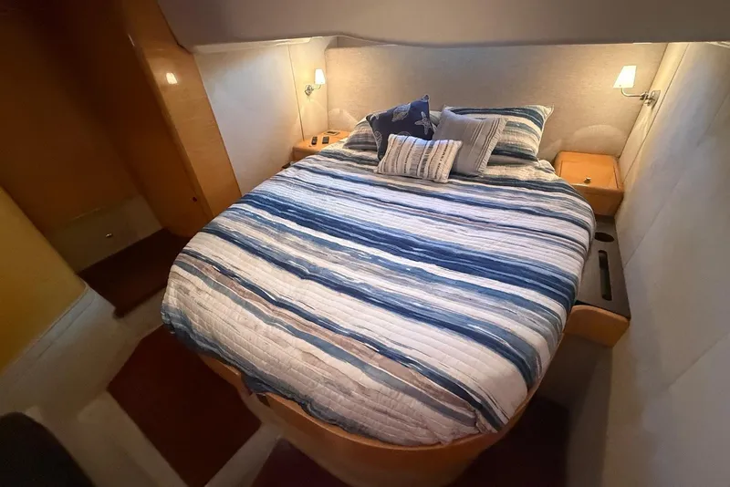 Slide: The Image of Luxurious cabin interior of 2009 Cranchi Mediterranee 43 yacht with cozy bedding. - 19