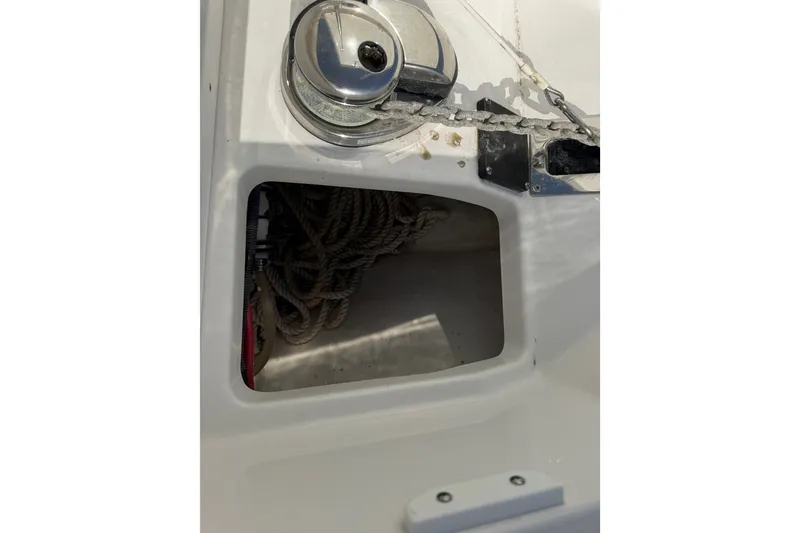 Slide: The Image of Anchor compartment of 2021 Monterey 385SE Super Express boat with ropes and winch. - 47