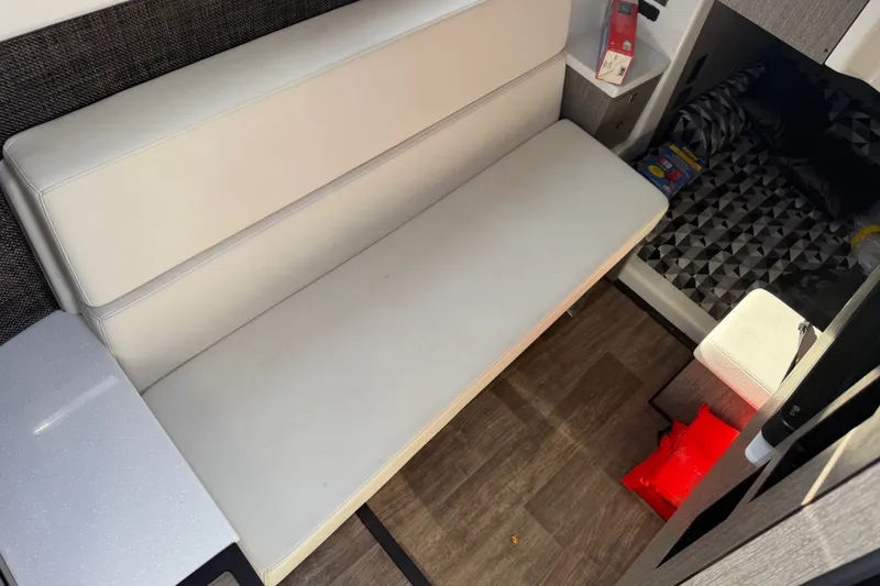 Slide: The Image of Interior of 2021 Monterey 385SE Super Express with white seating and modern design elements. - 50