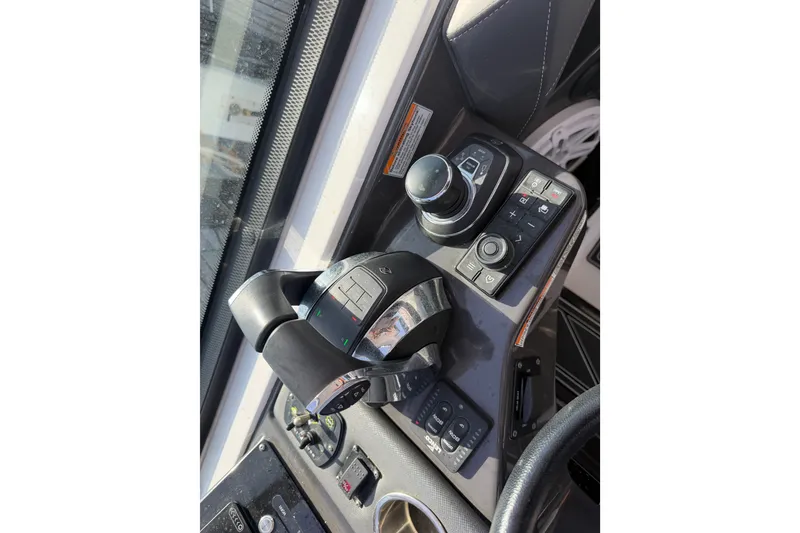 Slide: The Image of Control panel of a 2021 Monterey 385SE Super Express boat, featuring advanced navigation controls. - 45