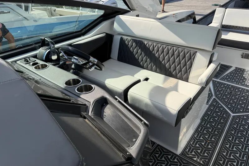 Slide: The Image of Interior of 2021 Monterey 385SE Super Express boat with modern seating and controls. - 29