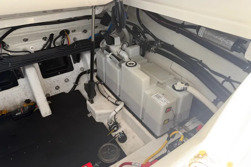 Slide: The Image of Engine compartment of a 2021 Monterey 385SE Super Express boat, showcasing wiring and components. - 52