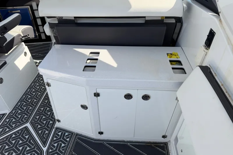 Slide: The Image of Interior of 2021 Monterey 385SE Super Express boat with sleek cabinetry and seating. - 23