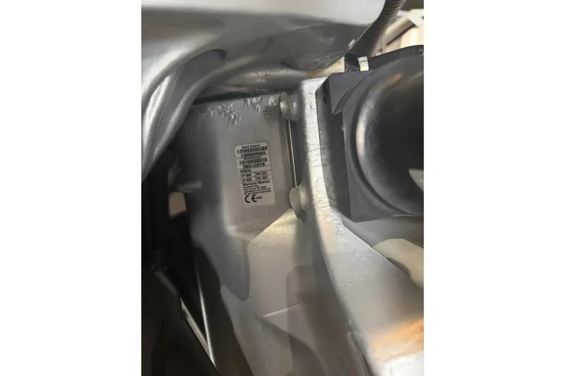 Slide: The Image of Close-up of a 2021 Monterey 385SE Super Express engine component with a visible label. - 67
