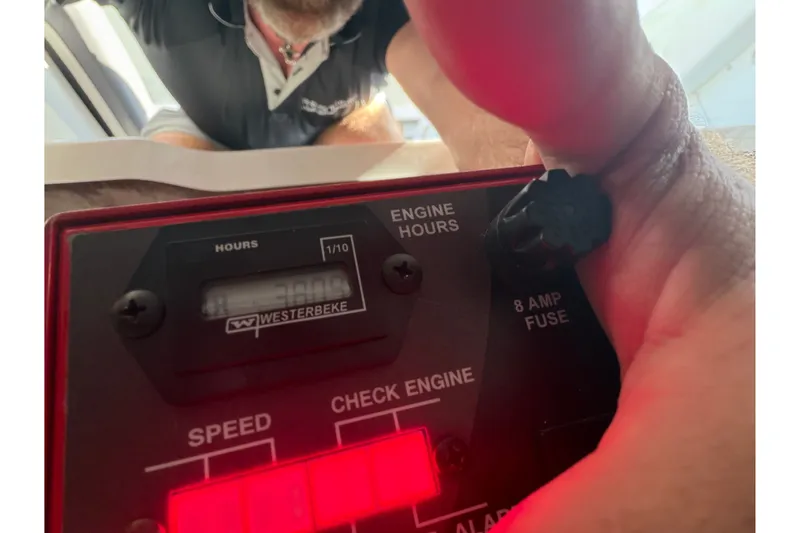 Slide: The Image of Close-up of a 2021 Monterey 385SE engine hour meter and control panel. - 55