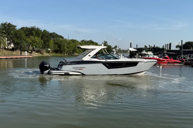 Slide: The Image of 2021 Monterey 385SE Super Express boat cruising on a calm river. - 19