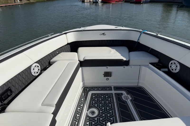 Slide: The Image of Luxurious seating area on a 2021 Monterey 385SE Super Express boat, docked by the water. - 51