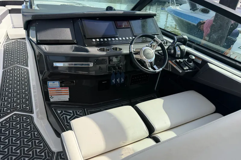 Slide: The Image of Cockpit of 2021 Monterey 385SE Super Express with modern controls and luxurious seating. - 31