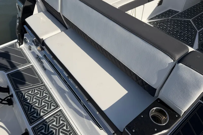 Slide: The Image of 2021 Monterey 385SE Super Express boat seating with stylish black and white upholstery. - 24