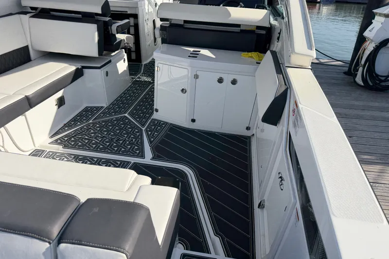 Slide: The Image of Interior of a 2021 Monterey 385SE Super Express boat with sleek seating and modern design. - 22