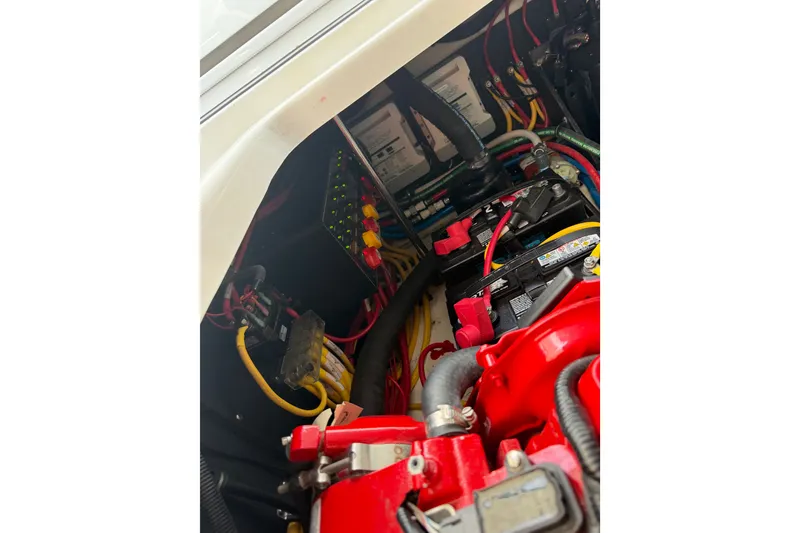 Slide: The Image of Engine compartment of 2021 Monterey 385SE Super Express with visible wiring and components. - 58