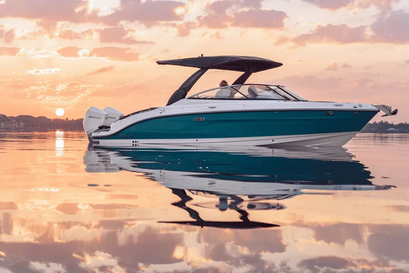 Slide: The Image of A 2027 Sea Ray SLX 280 Outboard on calm water at sunset. - 28