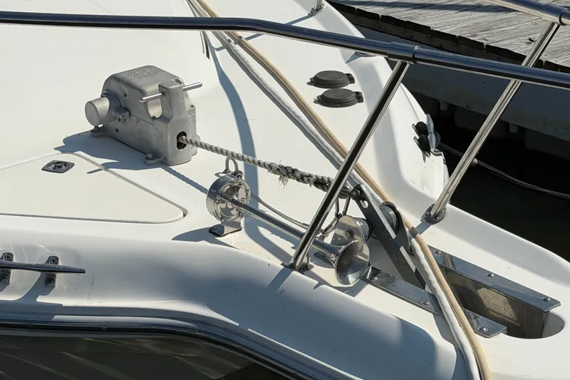 Slide: The Image of 1996 Sea Ray Sundancer 330 boat deck with anchor winch and railing. - 8
