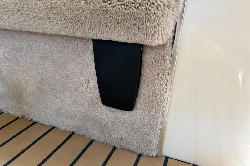 Slide: The Image of Carpeted interior detail of a 1996 Sea Ray Sundancer 330 boat. - 48