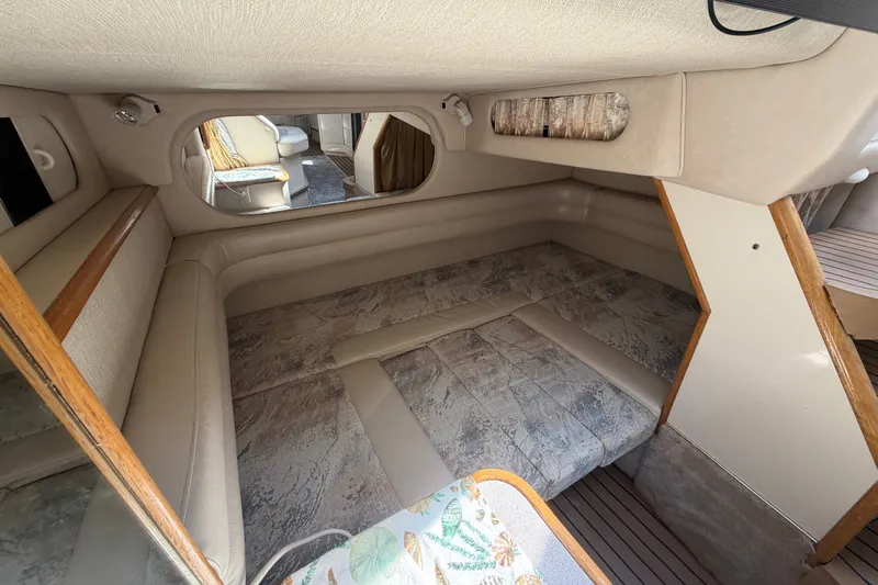 Slide: The Image of Interior cabin of a 1996 Sea Ray Sundancer 330, featuring a cozy sleeping area. - 42