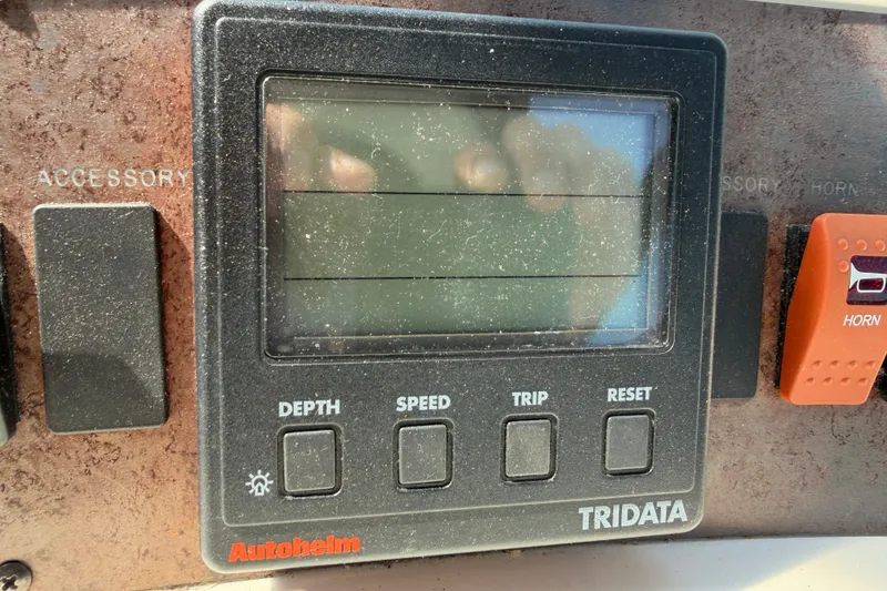 Slide: The Image of Control panel of a 1996 Sea Ray Sundancer 330 boat with Autopilot Tridata display. - 54