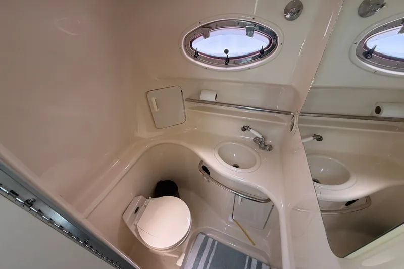 Slide: The Image of Bathroom interior of 1996 Sea Ray Sundancer 330 yacht with sink and toilet. - 46
