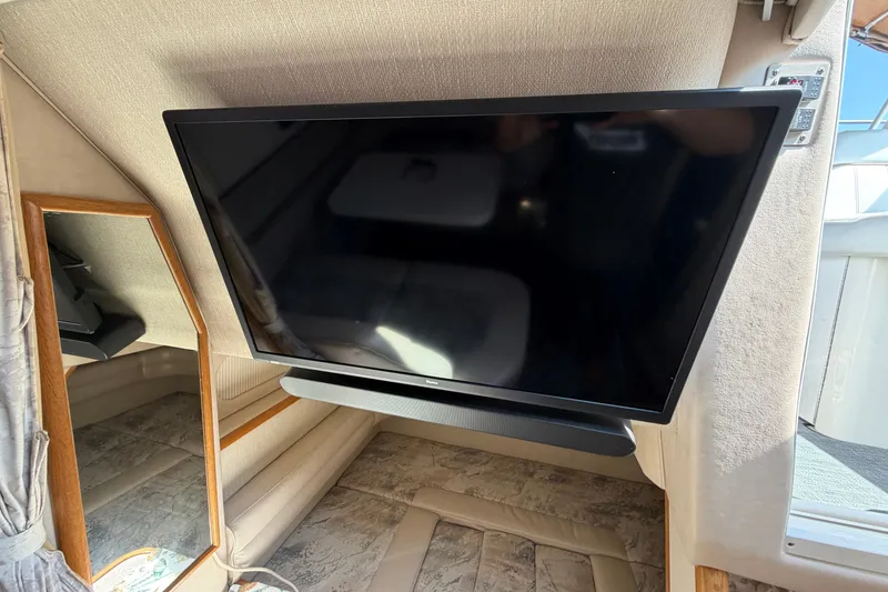 Slide: The Image of Interior of 1996 Sea Ray Sundancer 330 with mounted flat-screen TV and mirror. - 41