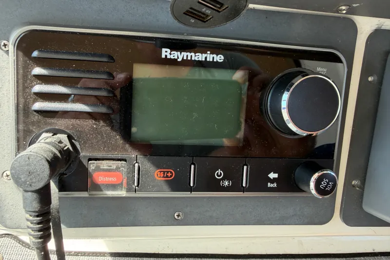 Slide: The Image of Raymarine marine radio on a 1996 Sea Ray Sundancer 330 boat dashboard. - 55