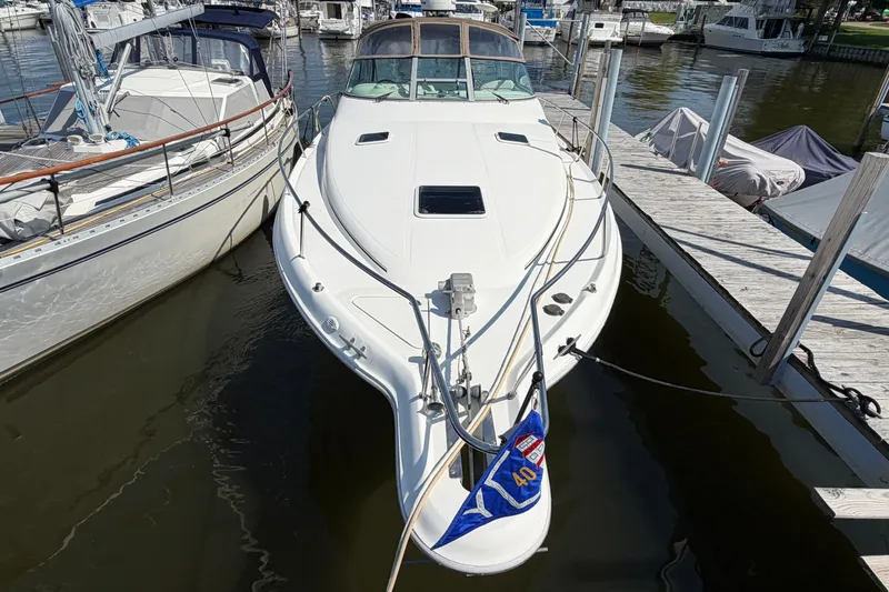 Slide: The Image of 1996 Sea Ray Sundancer 330 docked at marina, viewed from the bow. - 2
