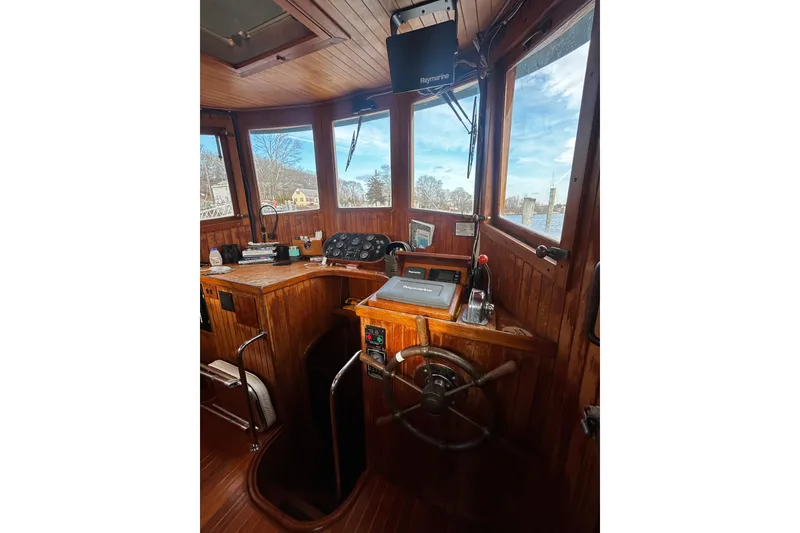 Slide: The Image of 1983 Lord Nelson Victory Tug/Trawler helm with wooden interior and navigational equipment. - 20