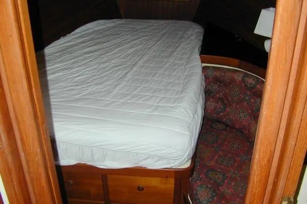 Slide: The Image of Cozy cabin interior of 1983 Lord Nelson Victory Tug with bed and patterned seating. - 22