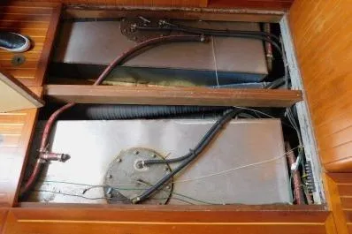 Slide: The Image of Engine compartment of 1983 Lord Nelson Victory Tug/Trawler with visible fuel tanks and wiring. - 32