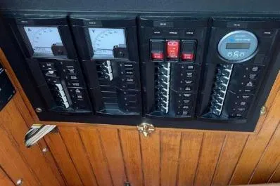 Slide: The Image of Electrical panel of a 1983 Lord Nelson Victory Tug/Trawler, featuring gauges and switches. - 33