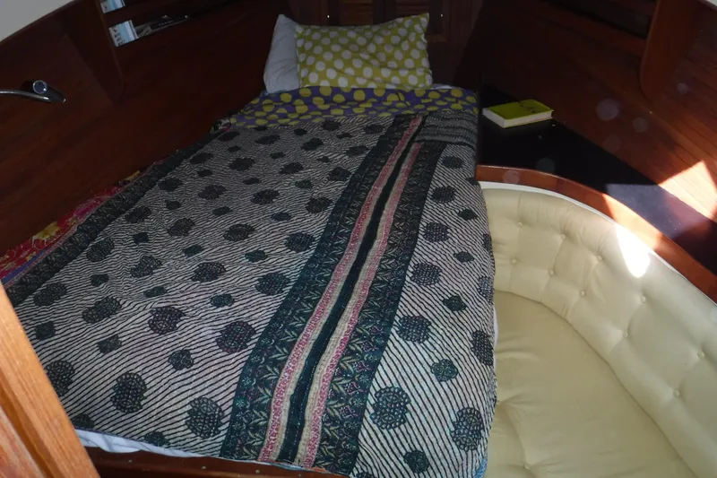 Slide: The Image of Cozy cabin interior of 1983 Lord Nelson Victory Tug/Trawler with patterned bedding. - 40