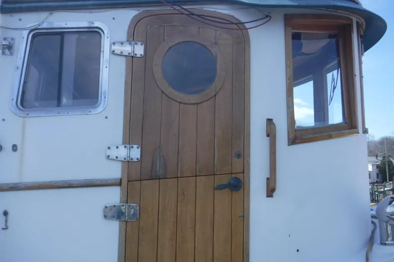 Slide: The Image of Wooden door and windows on 1983 Lord Nelson Victory Tug/Trawler boat. - 50