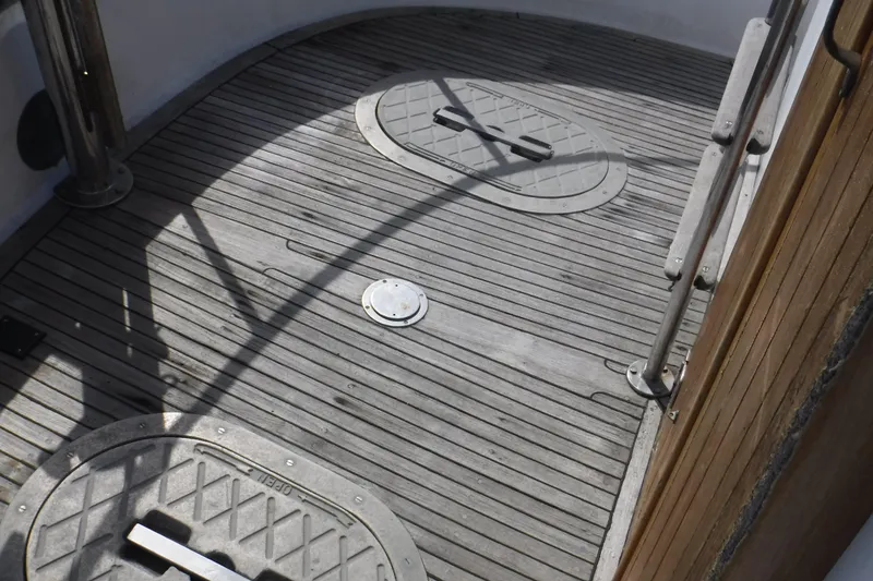 Slide: The Image of Deck of 1983 Lord Nelson Victory Tug/Trawler with metal hatches and wooden flooring. - 51