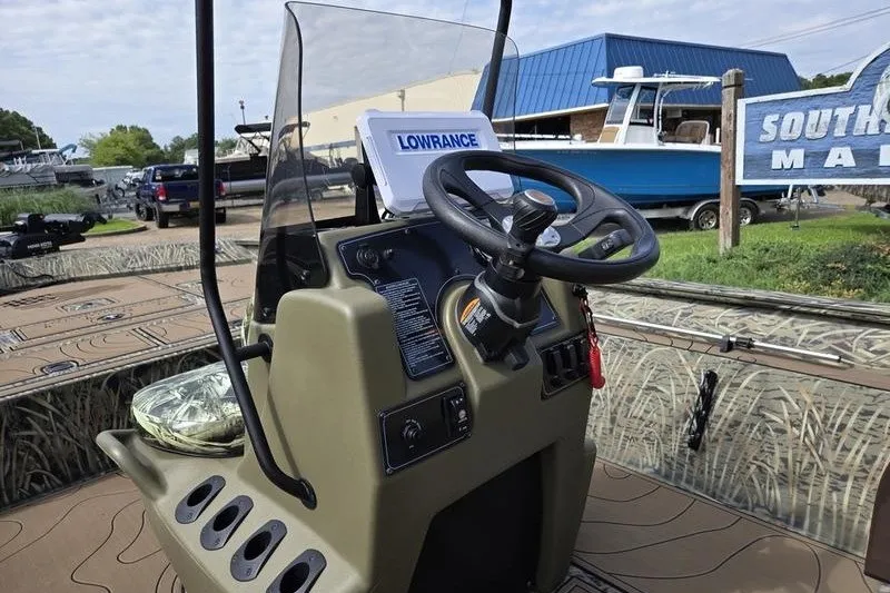 Slide: The Image of 2025 Tracker Grizzly 2072 CC boat console with steering wheel and Lowrance navigation system. - 5