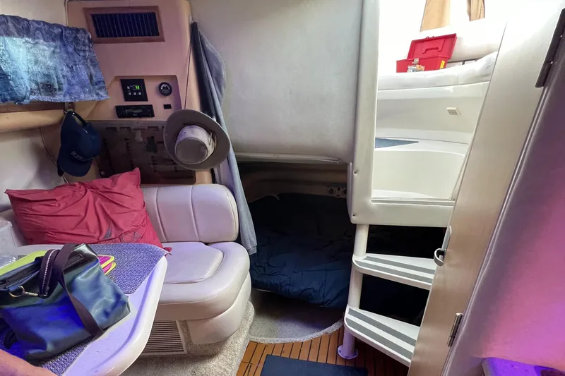 Slide: The Image of Interior of 1998 Regal 292 Commodore boat with seating and sleeping area. - 17