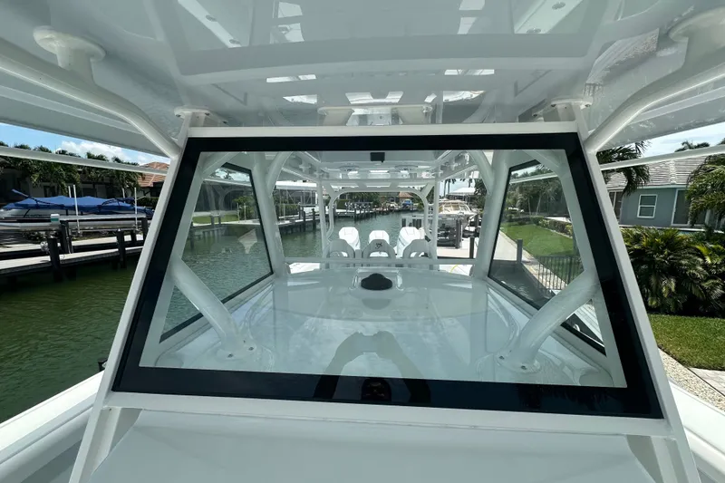 Slide: The Image of 2026 Yellowfin 39 Offshore boat docked, showcasing sleek design and spacious interior. - 38