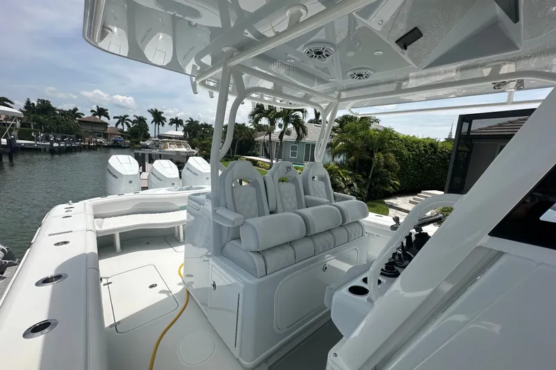 Slide: The Image of 2026 Yellowfin 39 Offshore boat interior with luxurious seating and multiple outboard engines. - 27