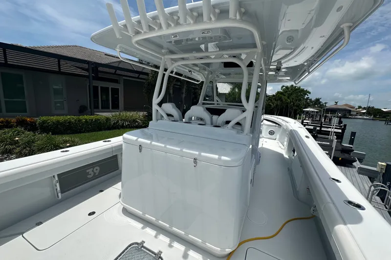 Slide: The Image of 2026 Yellowfin 39 Offshore boat docked, showcasing sleek design and spacious deck. - 31