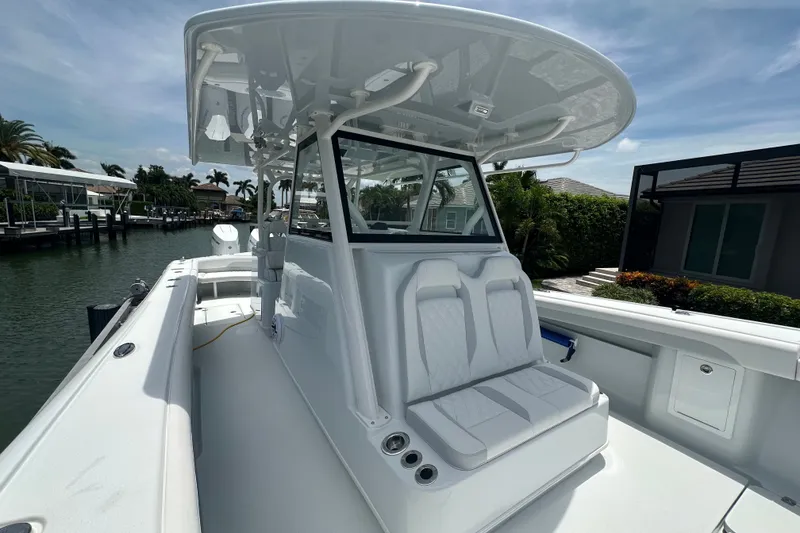 Slide: The Image of 2026 Yellowfin 39 Offshore boat with sleek white seating and modern design. - 26
