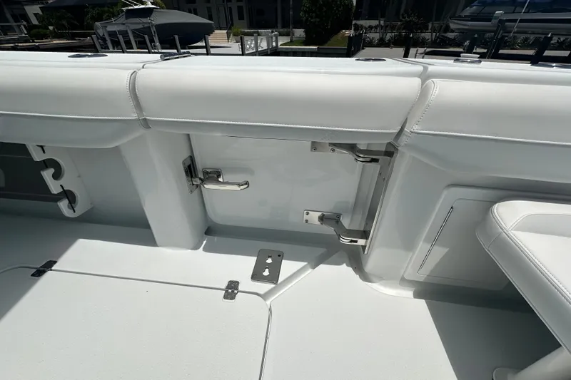 Slide: The Image of 2026 Yellowfin 39 Offshore boat interior with white seating and stainless steel hardware. - 29