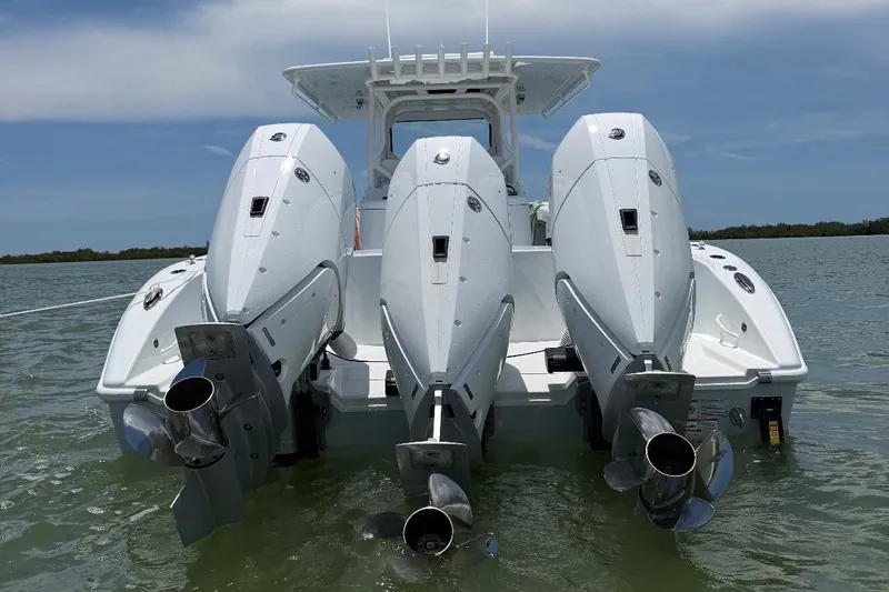 Slide: The Image of 2026 Yellowfin 39 Offshore boat with triple outboard engines on water. - 2