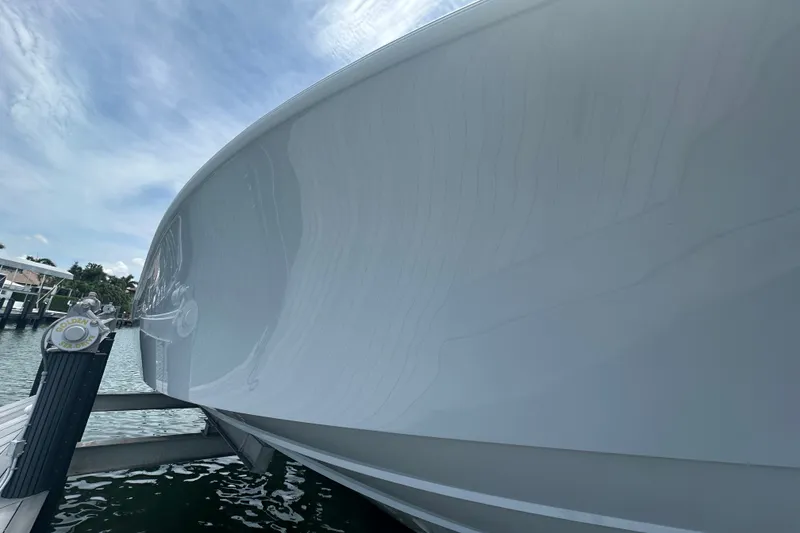 Slide: The Image of 2026 Yellowfin 39 Offshore boat docked, showcasing sleek hull design and waterfront setting. - 17