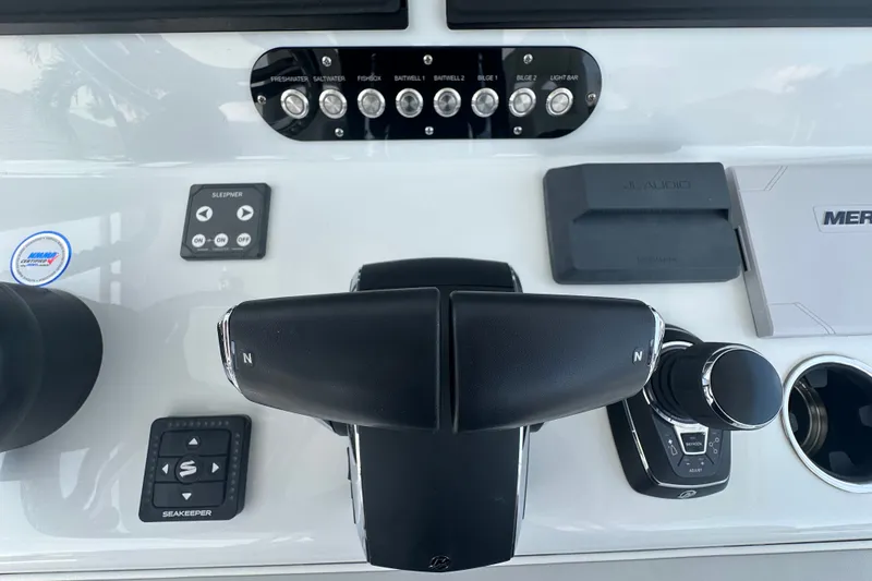 Slide: The Image of Control panel of 2026 Yellowfin 39 Offshore boat with throttle and navigation controls. - 41