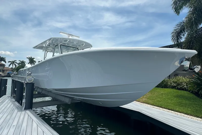 Slide: The Image of 2026 Yellowfin 39 Offshore boat docked, showcasing sleek design and modern features. - 22